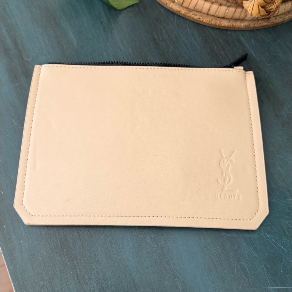 Yves Saint Laurent Beaute beige non leather cosmetic pouch.